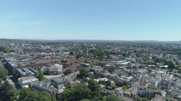 Rising aerial above exeter city centre, Devon, UK. Sunny skyline ...