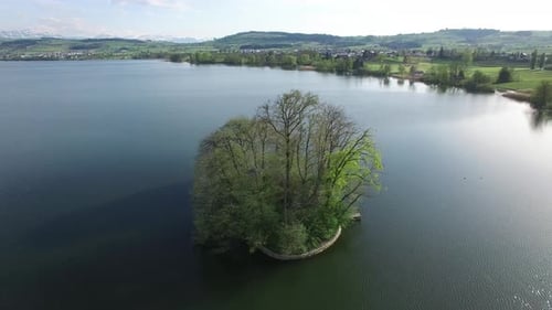 A Serene Island Surrounded By Calm Tranquil Waters Offering a Peaceful Retreat Experience