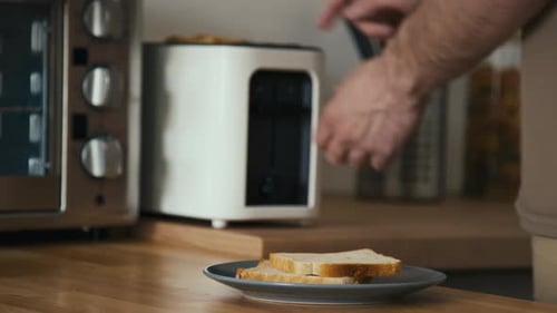 Toasting Bread Slices in Modern Kitchen
