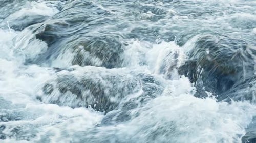 Pure Water Stream Running Through Stone Boulders