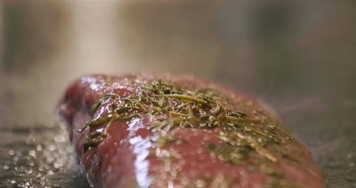 Close Up of a Seasoned Piece of Meat Cooking
