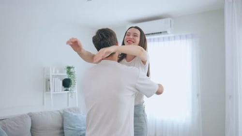 Affectionate Couple Embracing in Bright Modern Home