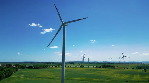 Wind farm generating clean renewable electrical energy. Alternative green energy.