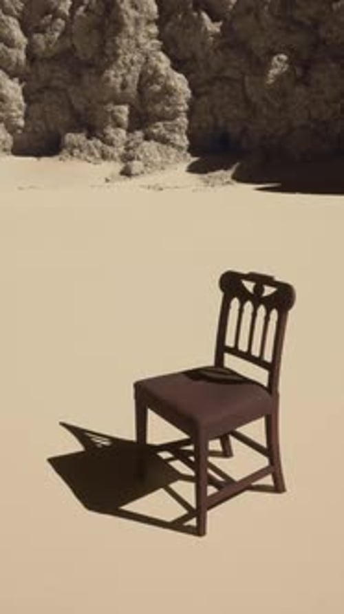 A Chair Sitting on Top of a Sandy Beach