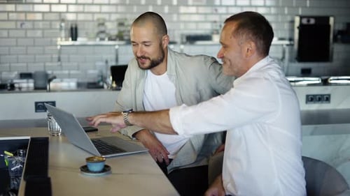 Two Motivated Businessmen are Discussing a Project During Lunch