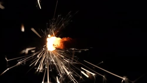 Sparkler Ignites with Bright Light and Sparks