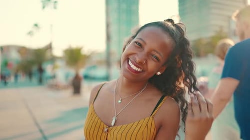 Closeup of smiling woman on urban city background