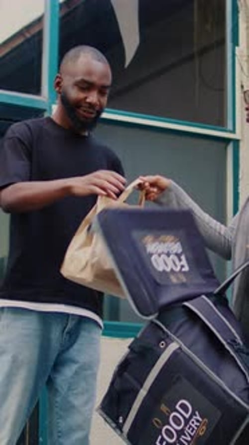 Food Delivery Woman Handing Bag to Customer