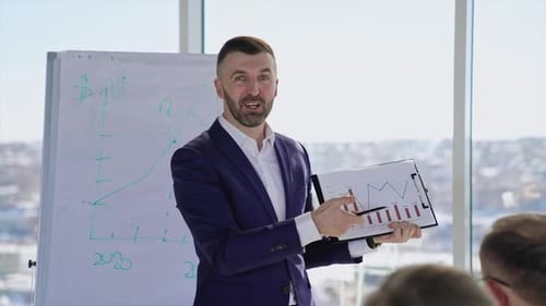 Business Presentation by Smiling Man Holding Data Sheet