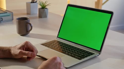 Student Watching Chroma Key Laptop in Modern Home Workplace Closeup Unknown Man