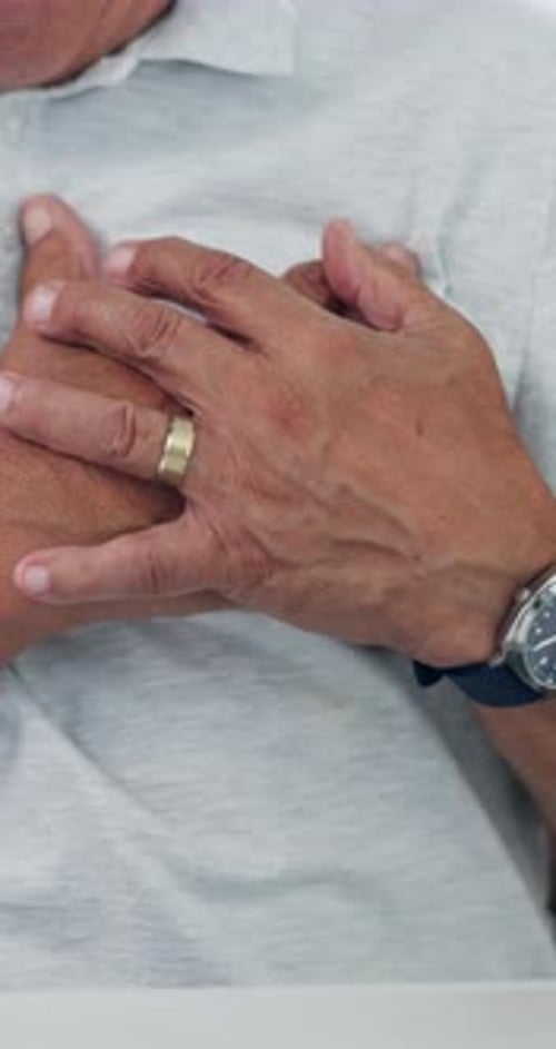 Heart attack, hands and medical with chest of old man for emergency, high blood pressure