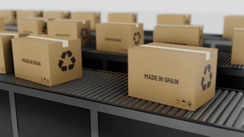 Stream Of Boxes Labeled 'Made In The Spain' Moving On a Conveyor Line