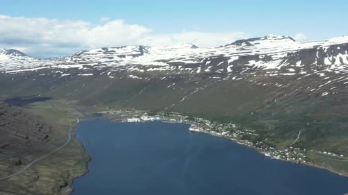 Aerial of Eskifjörður town in scenic Reyðarfjörður fjord in Iceland
