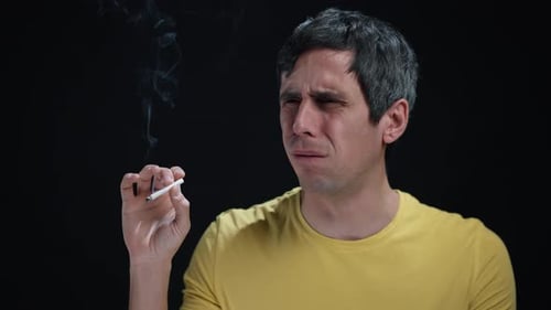 cigarettes and coughing Coughing Man Holding a Burning Cigarette cigarettes and coughing Coughing Man Holding a Burning Cigarette