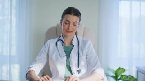 Medicare Specialist Hands Typing Keyboard Analyzing Xray in Clinic Closeup