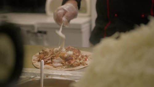 The process of creating fast food on street - shawarma, pita, doner kebab
