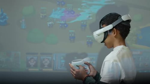 Black Boy Using Virtual Reality Googles and Motion-Sensing Controllers