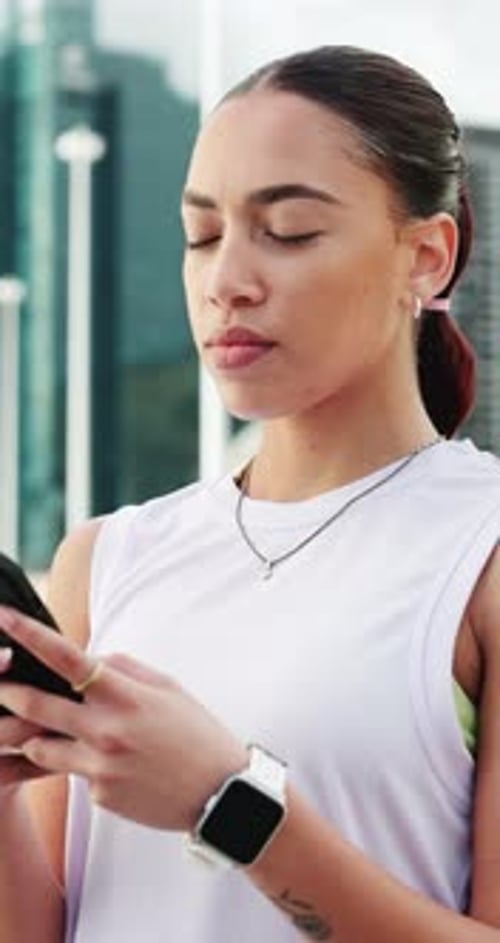 Woman, phone and texting in city with fitness, check stats or search for running route