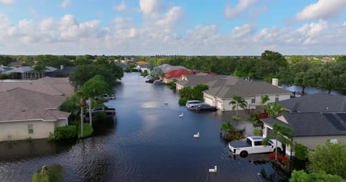 Flooded Road with Sunken Cars in Surrounded with Water Florida Residential Area Consequences of