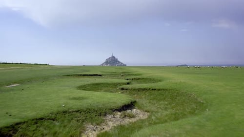 Aerial view of mont saint michel and pastures, France.