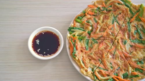 Delicious Vegetable Pancake on Plate with Sauce