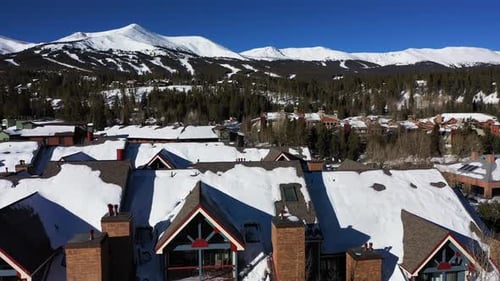 Aerial view buildings a and houses in Breckenridge, sunny Colorado - low, drone shot. Low aerial of