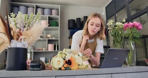 Young Woman Working at a Flower Shop