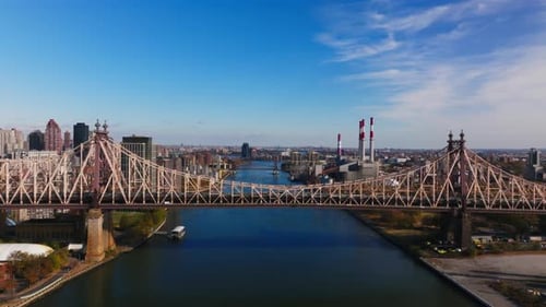 Aerial View Captures the Queensboro Bridge Showcasing the East River and Roosevelt Island Between