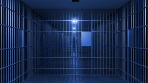 Jail cell bars closing, depicting imprisonment and loss of freedom
