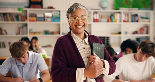 Teacher smiling in classroom with students