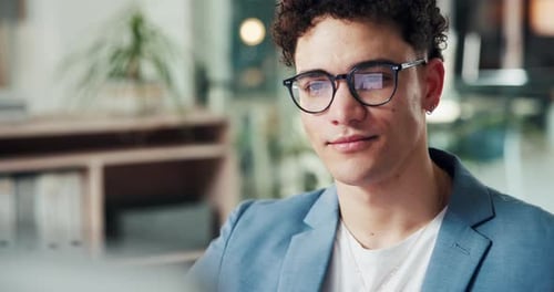 Smiling Man in Blue Blazer at Workplace