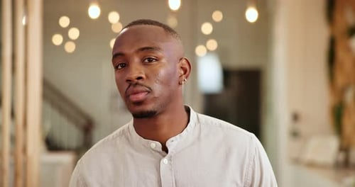 Worker, face and man with smile in hotel for front desk assistance, friendly concierge or reception