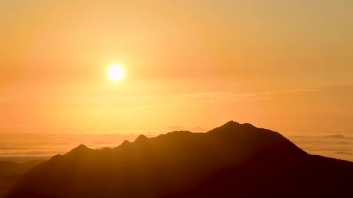Golden Sunset Over Mountain Range Silhouette