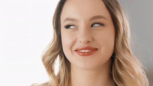 Woman Having Makeup Applied with Brush, Close-Up