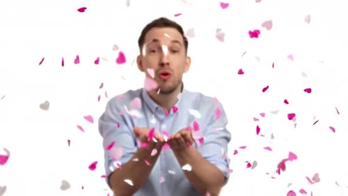Man Blowing Heart Confetti for Happy Birthday