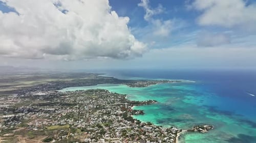 An aerial view of a city and the ocean