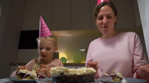 Mother and Daughter Celebrate Birthday with Cake