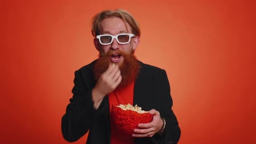 Enthusiastic Young Adult with Popcorn and 3D Glasses