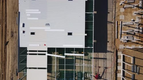Construction Site with Steel Frame Structure of Warehouse Building Aerial View