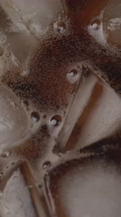 Uhd Slow Motion Cola Bubbles Rising In A Glass
