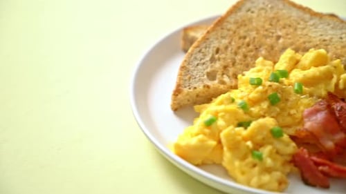 Scrambled Eggs, Bacon, and Toast Breakfast Close-Up
