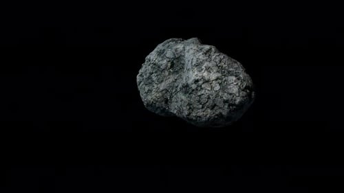 an asteroid flying in space, the video has an alpha channel