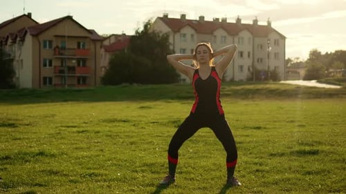 Young Adult Woman Doing Yoga Exercises Outdoors