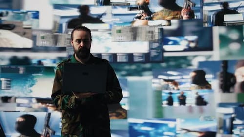 Man With Laptop Amidst Technology Screens