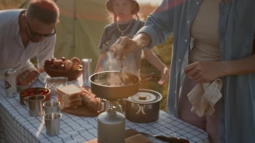 Family Camping Trip Cooking Outdoors in Summer