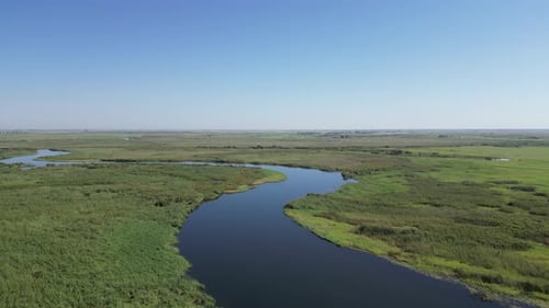 Aerial fly over view of the mighty Zambezi River flowing down to the Victoria Falls