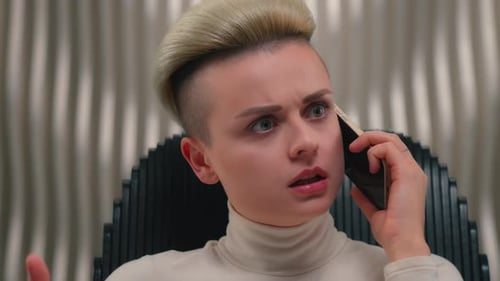 Woman Talking on Phone with Frustrated Expression