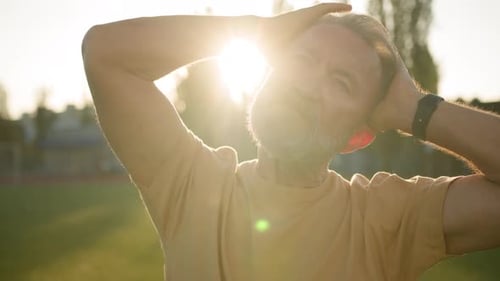 Close Up Caucasian European Pensioner Stretch Neck Muscles Head Sporty Elderly Man Warmup