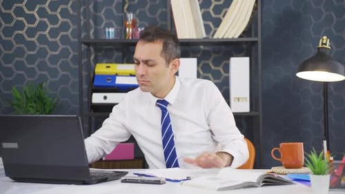 Excited Businessman Celebrating Success in the Office