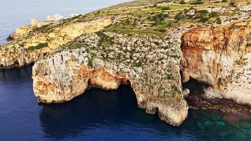 Aerial view of stunning coastal cliffs in Malta's pristine waters